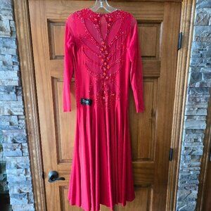 STESH red ballroom dance dress with mesh sleeves and rhinestone embellishments